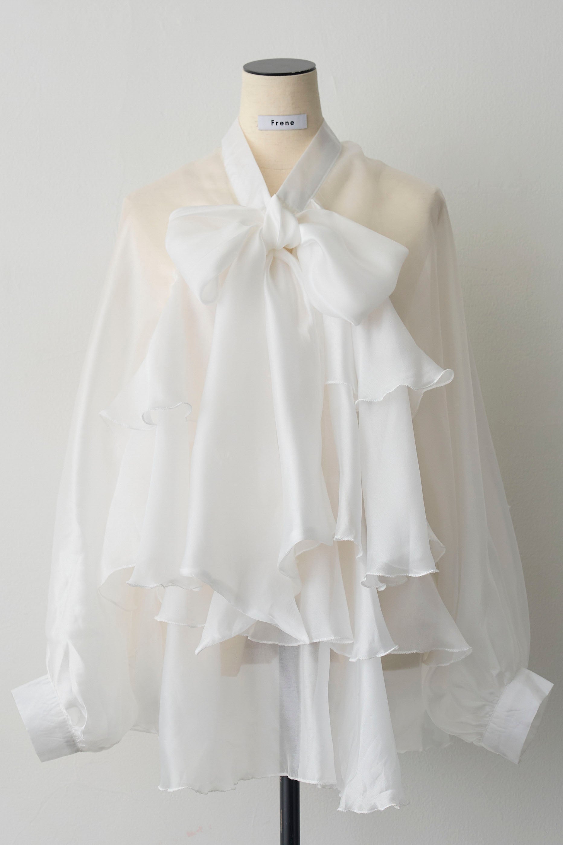 予約]フロントBIGリボンティアードエアリーチュニック – Frene
