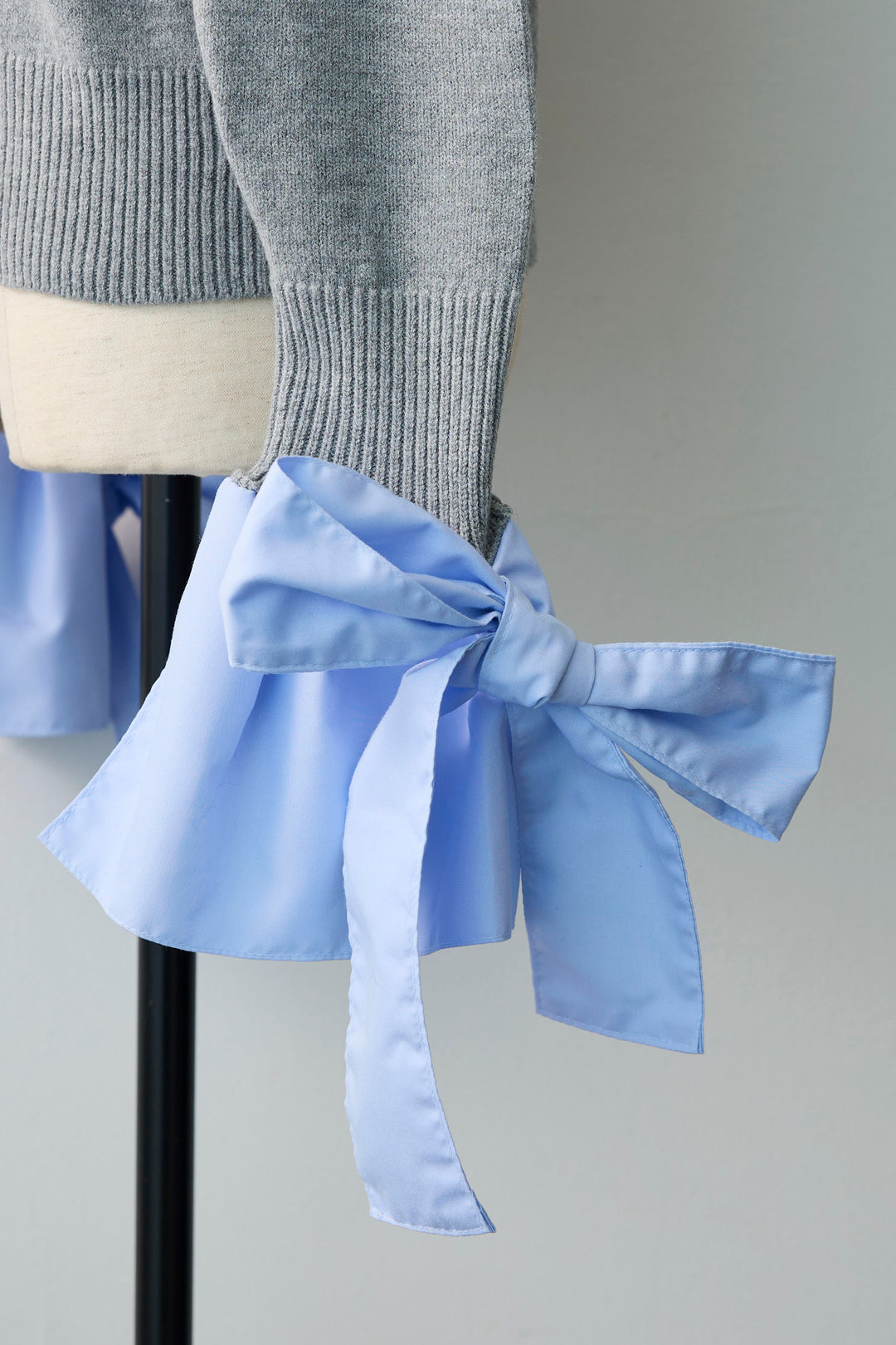 [予約]BIGリボンカフスデザインニットドッキングカーデ